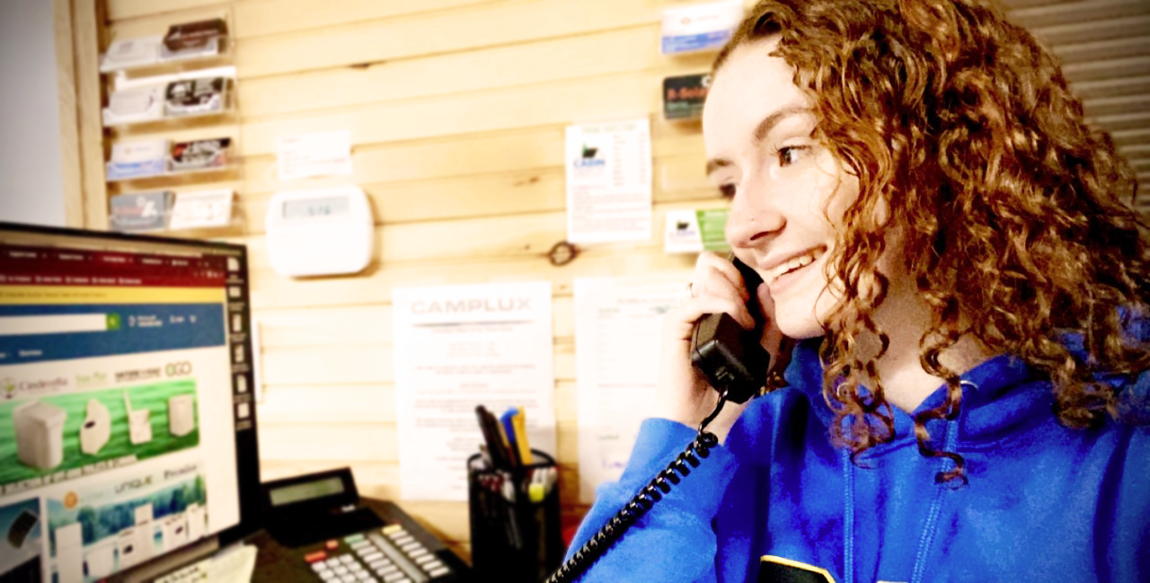 Jessica Porter taking a call from a valued customer of The Cabin Depot